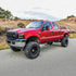 Westin 1999-2016 Ford F-250/F-350/F-450/F-550 Crew Cab Outlaw Drop Nerf Step Bars Textured Black